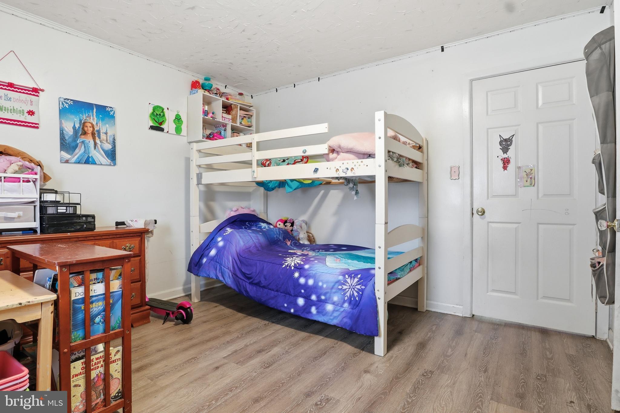 83 North Main Street Dover, PA 17315 - Photo 13 of 28 a bedroom with a bed and a desk