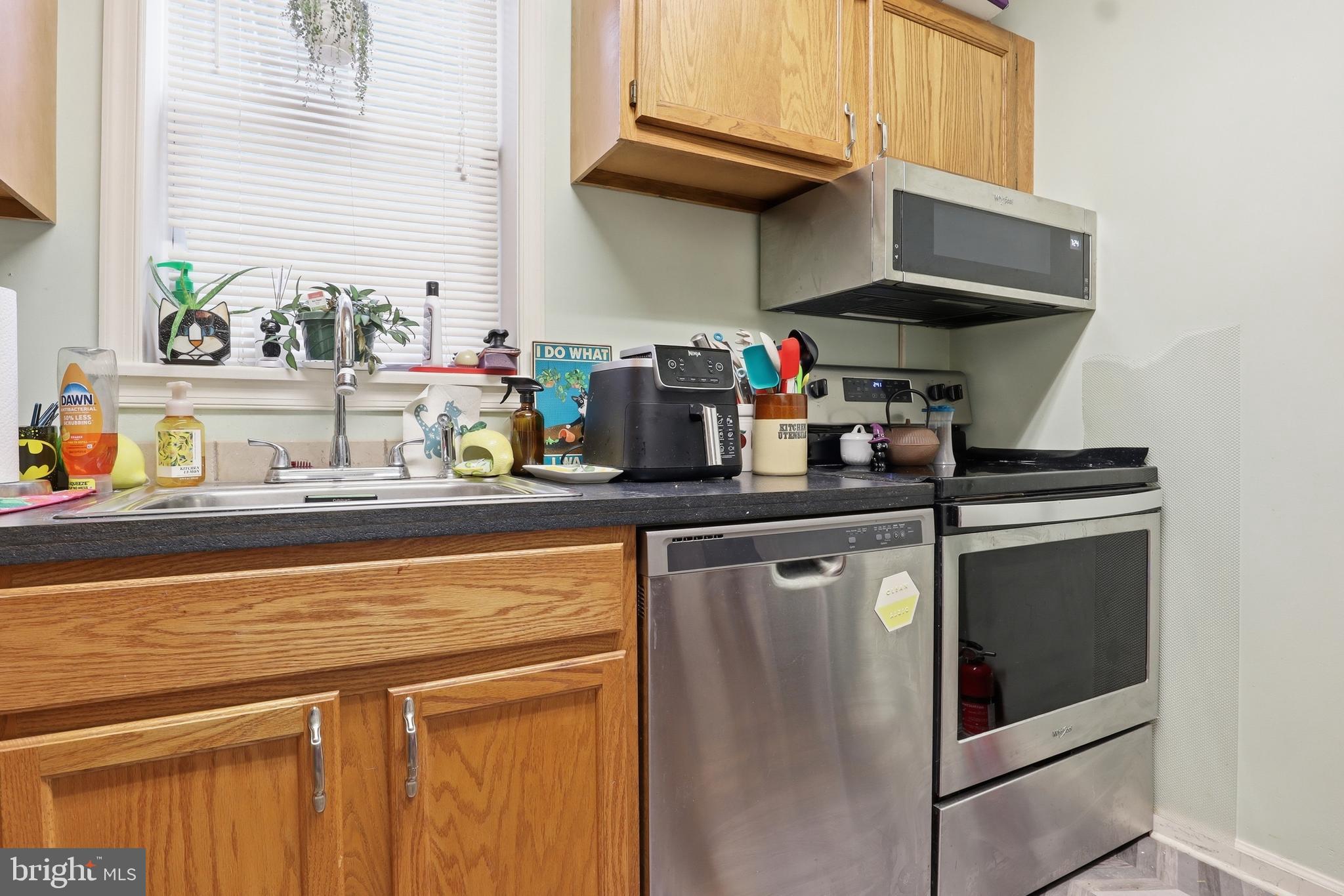 83 North Main Street Dover, PA 17315 - Photo 17 of 28 a kitchen with stainless steel appliances granite countertop a sink and a stove