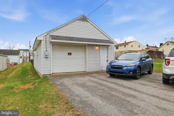 a view of a car in front of a house