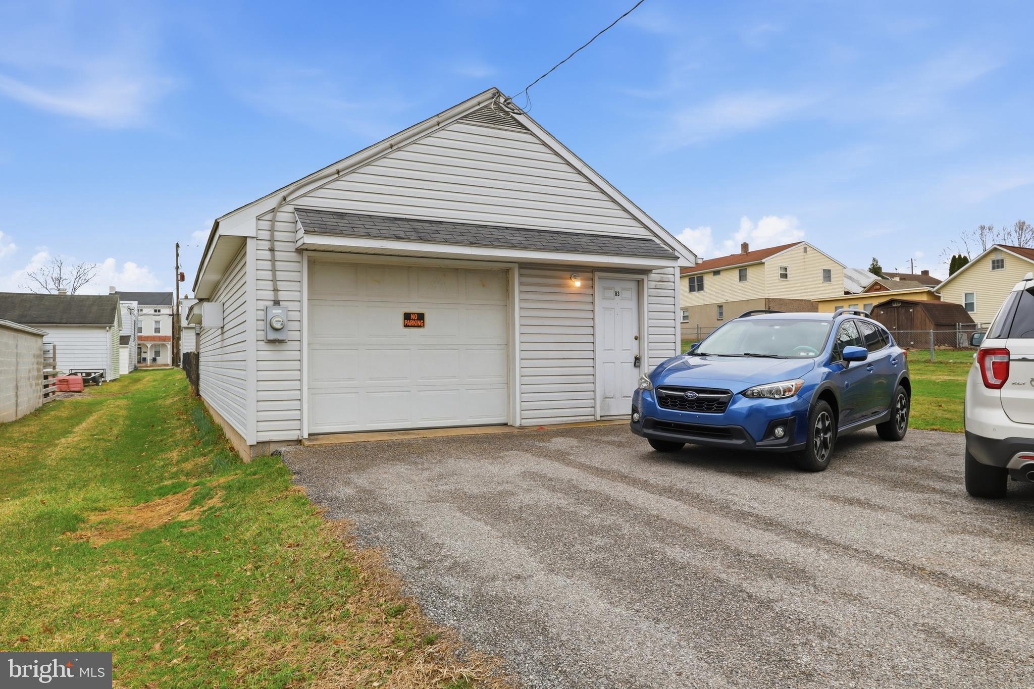 83 North Main Street Dover, PA 17315 - Photo 27 of 28 a car parked in front of a house
