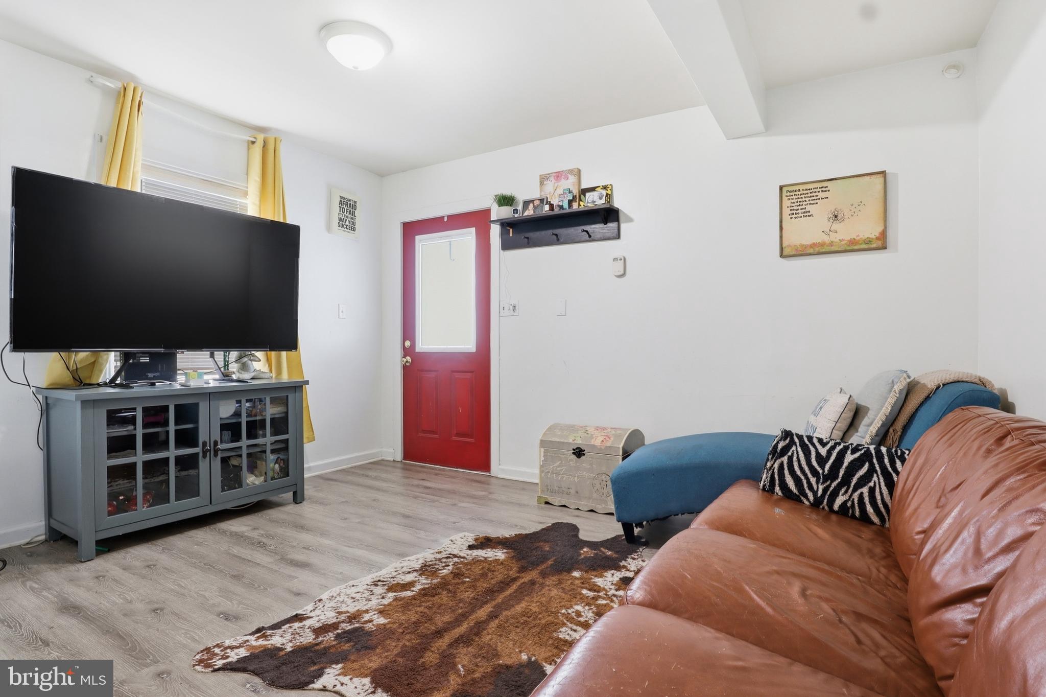 83 North Main Street Dover, PA 17315 - Photo 6 of 28 a living room with furniture and a flat screen tv