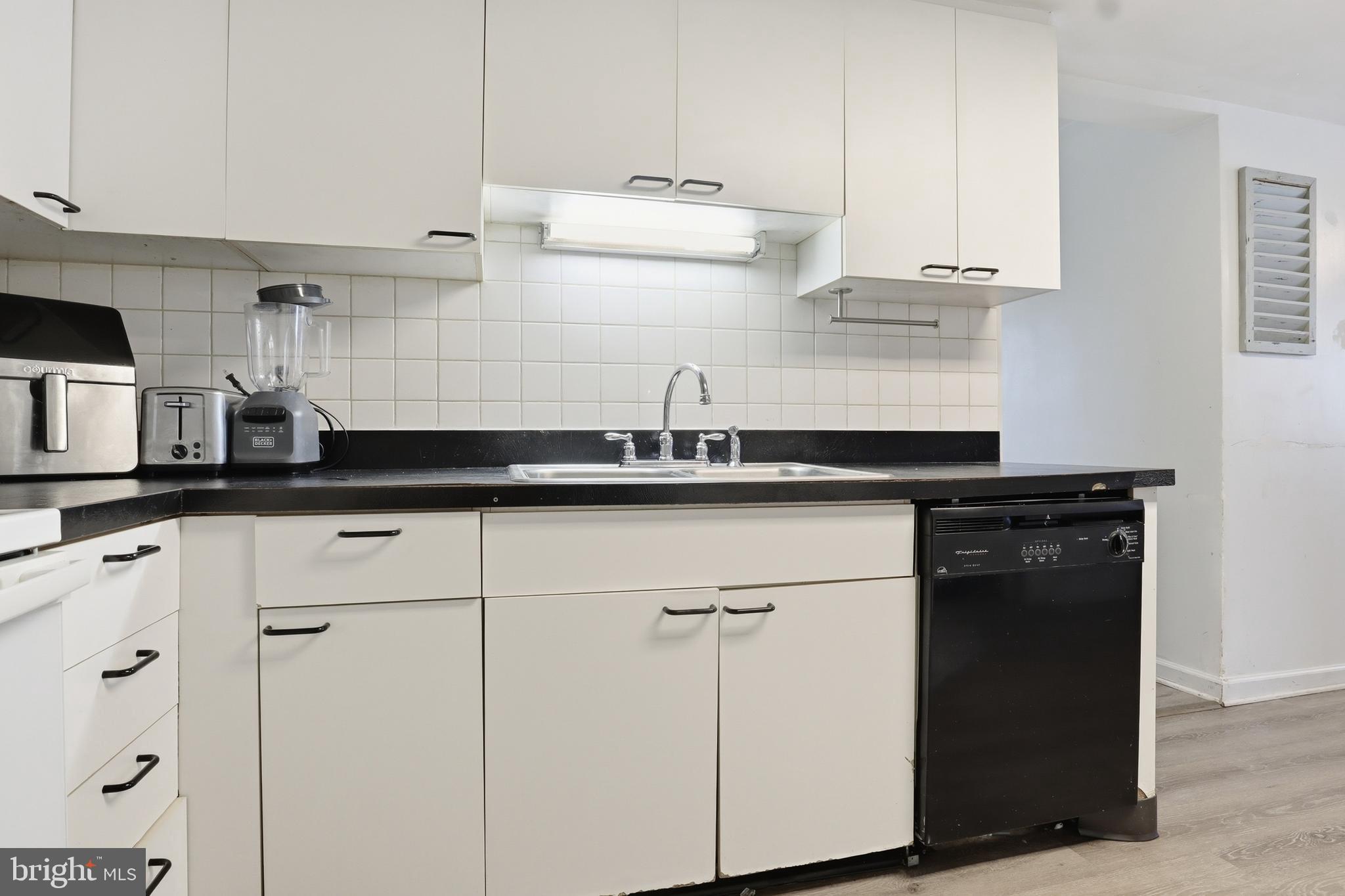 83 North Main Street Dover, PA 17315 - Photo 9 of 28 a kitchen with a sink and cabinets