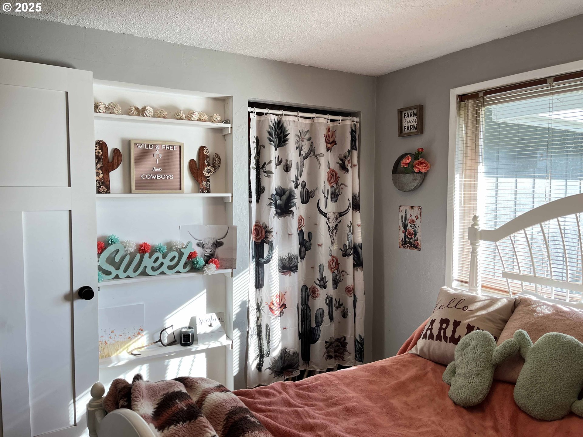2045 19th Street Florence, OR 97439 - Photo 12 of 43 a bedroom with a bed and a window