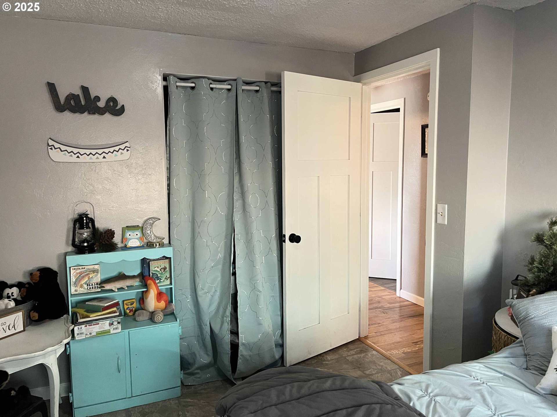 2045 19th Street Florence, OR 97439 - Photo 18 of 43 a view of a bedroom with baby bed and closet