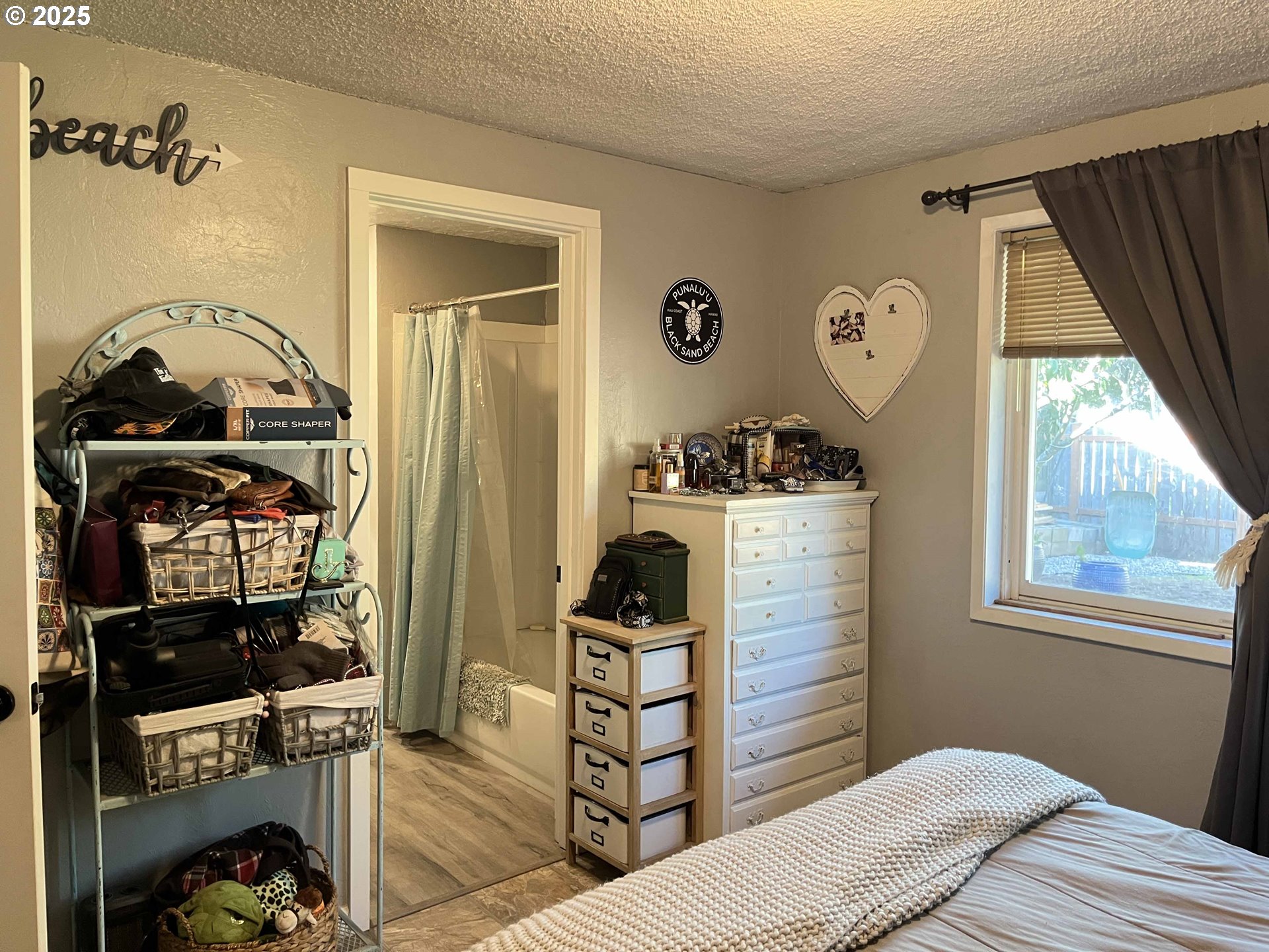 2045 19th Street Florence, OR 97439 - Photo 21 of 43 a bedroom with a bed and a window
