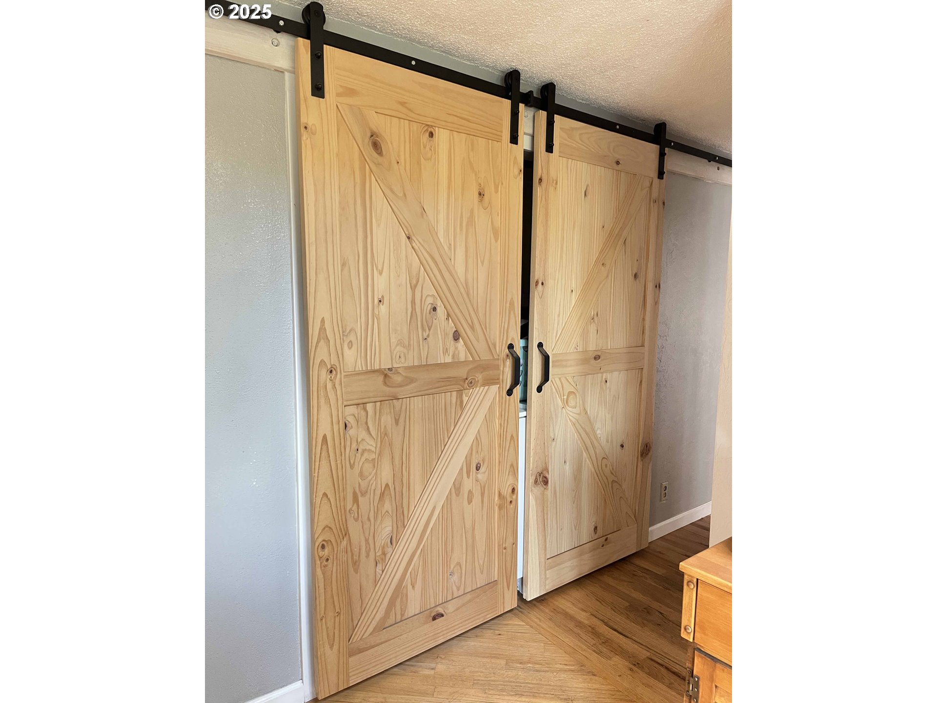 2045 19th Street Florence, OR 97439 - Photo 25 of 43 a view of walk in closet with window