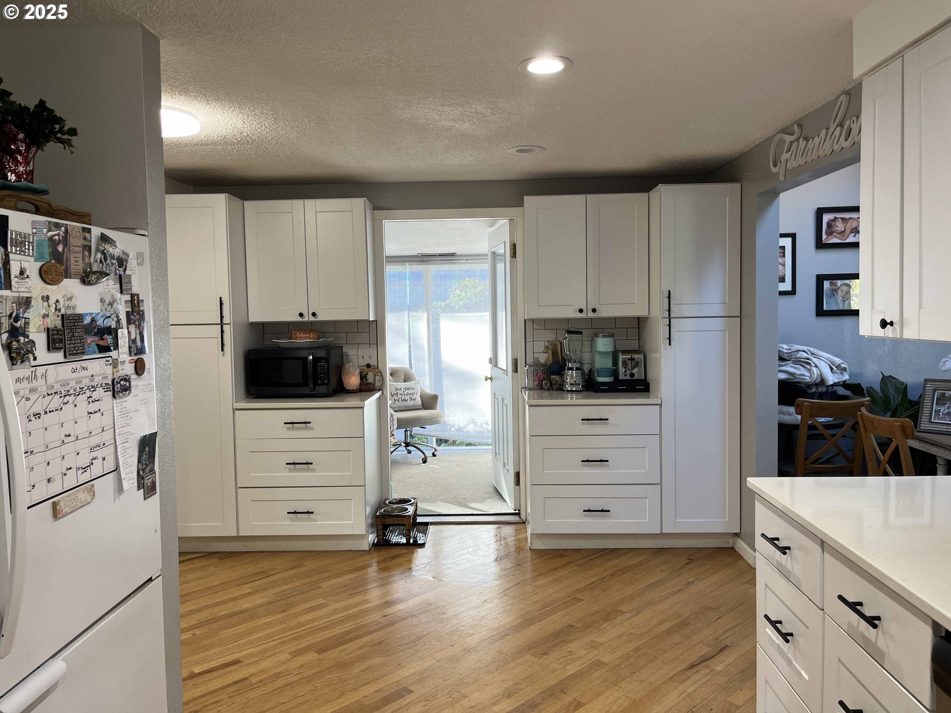 2045 19th Street Florence, OR 97439 - Photo 31 of 43 a kitchen with stainless steel appliances a stove and cabinets
