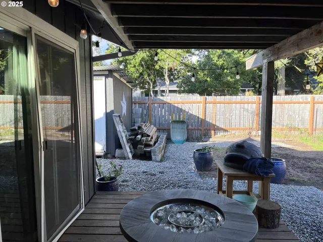a view of a backyard with sitting area and furniture