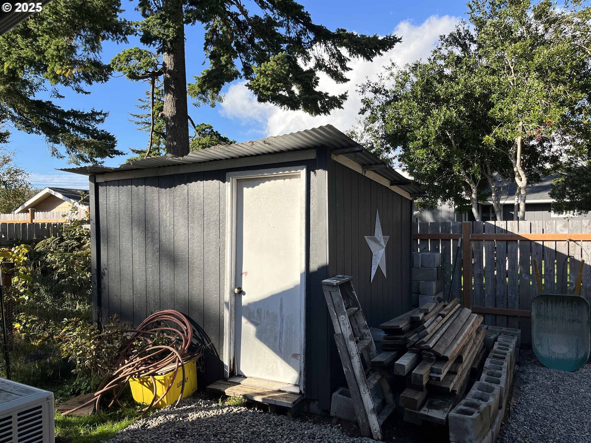 2045 19th Street Florence, OR 97439 - Photo 38 of 43 a view of a backyard with sitting area and furniture