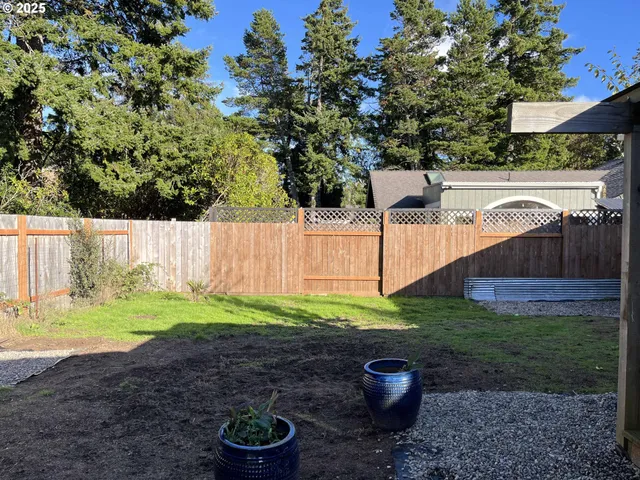 a backyard of a house with lots of green space