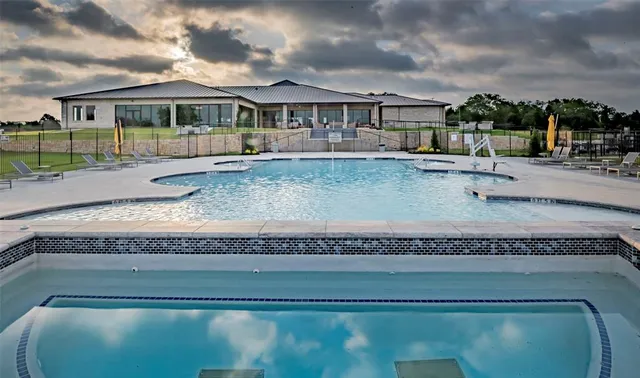 a view of swimming pool from a balcony