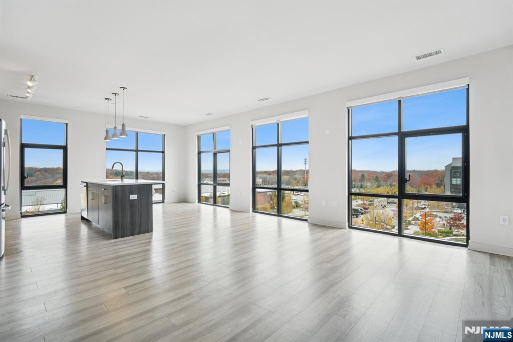 300 Market Street, Unit 422 Montvale, NJ 07645 - Photo 1 of 26 a view of an empty room with a window and wooden floor