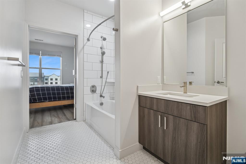 300 Market Street, Unit 422 Montvale, NJ 07645 - Photo 18 of 26 a bathroom with a sink a toilet and shower