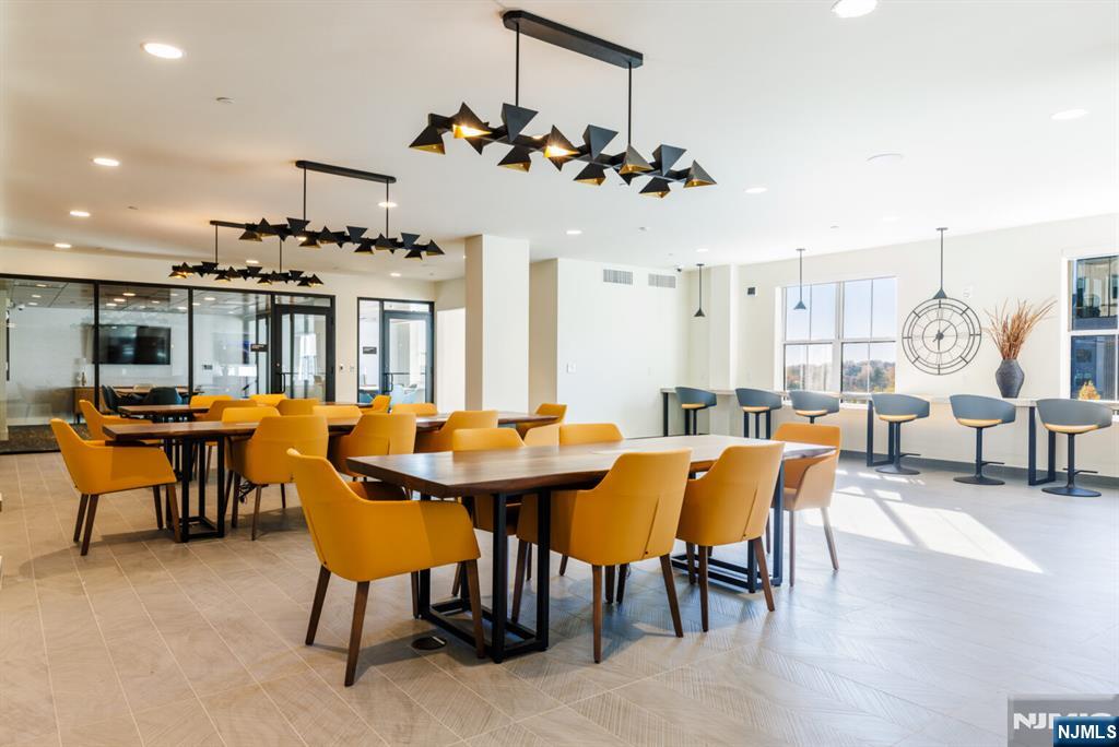 300 Market Street, Unit 422 Montvale, NJ 07645 - Photo 26 of 26 a view of a dining room with furniture and wooden floor