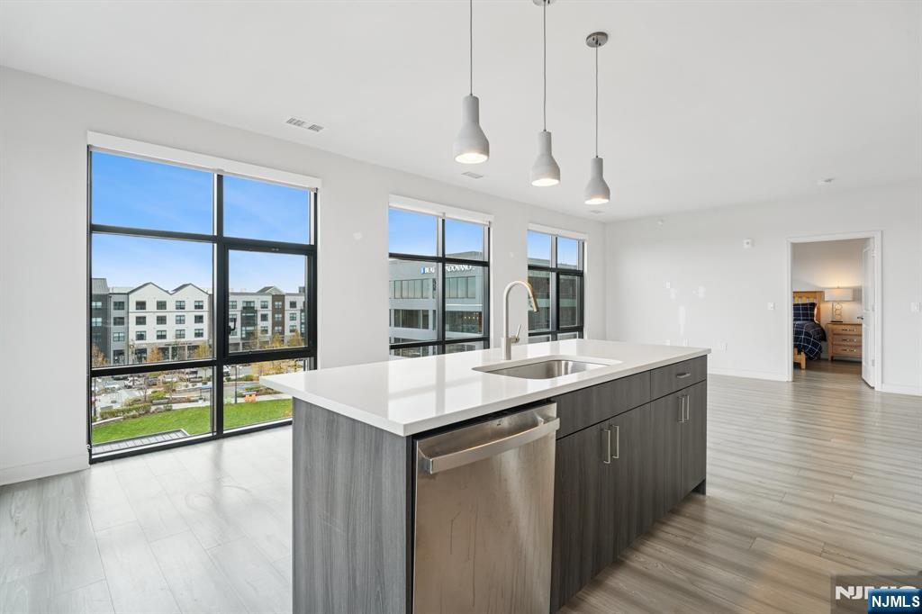 300 Market Street, Unit 422 Montvale, NJ 07645 - Photo 6 of 26 a room with wooden floor and window