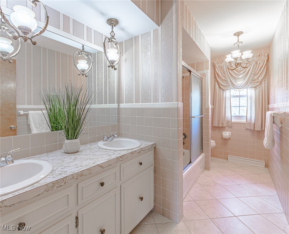 3375 Bancroft Road Akron, OH 44333 - Photo 29 of 45 Shared bathroom on the top level of the home with a Dual vanity, large mirror, and shower/bath.