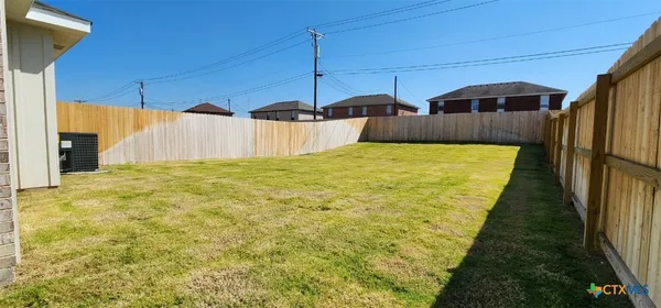 a view of a swimming pool with a yard