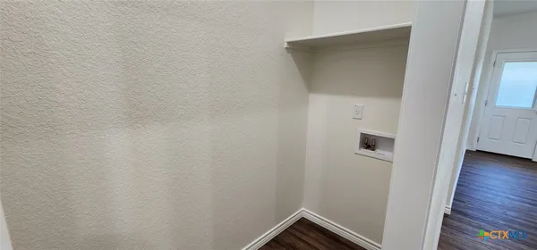 a view of small space with wooden floor