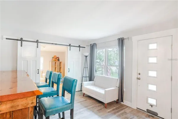 a living room with furniture and a window