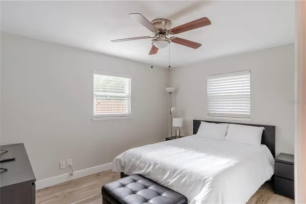 a bedroom with a bed and window