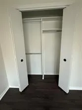 a view of wooden floor with a window