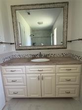 7 Yale Circle Richardson, TX 75081 - Photo 19 of 19 a bathroom with a sink and a mirror