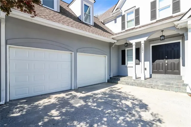 a bathroom with a tub and shower