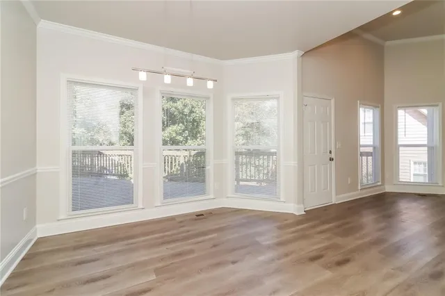 a kitchen with stainless steel appliances a sink stove and cabinets