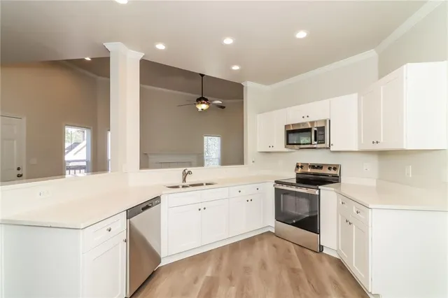 a view of cabinets with wooden floor