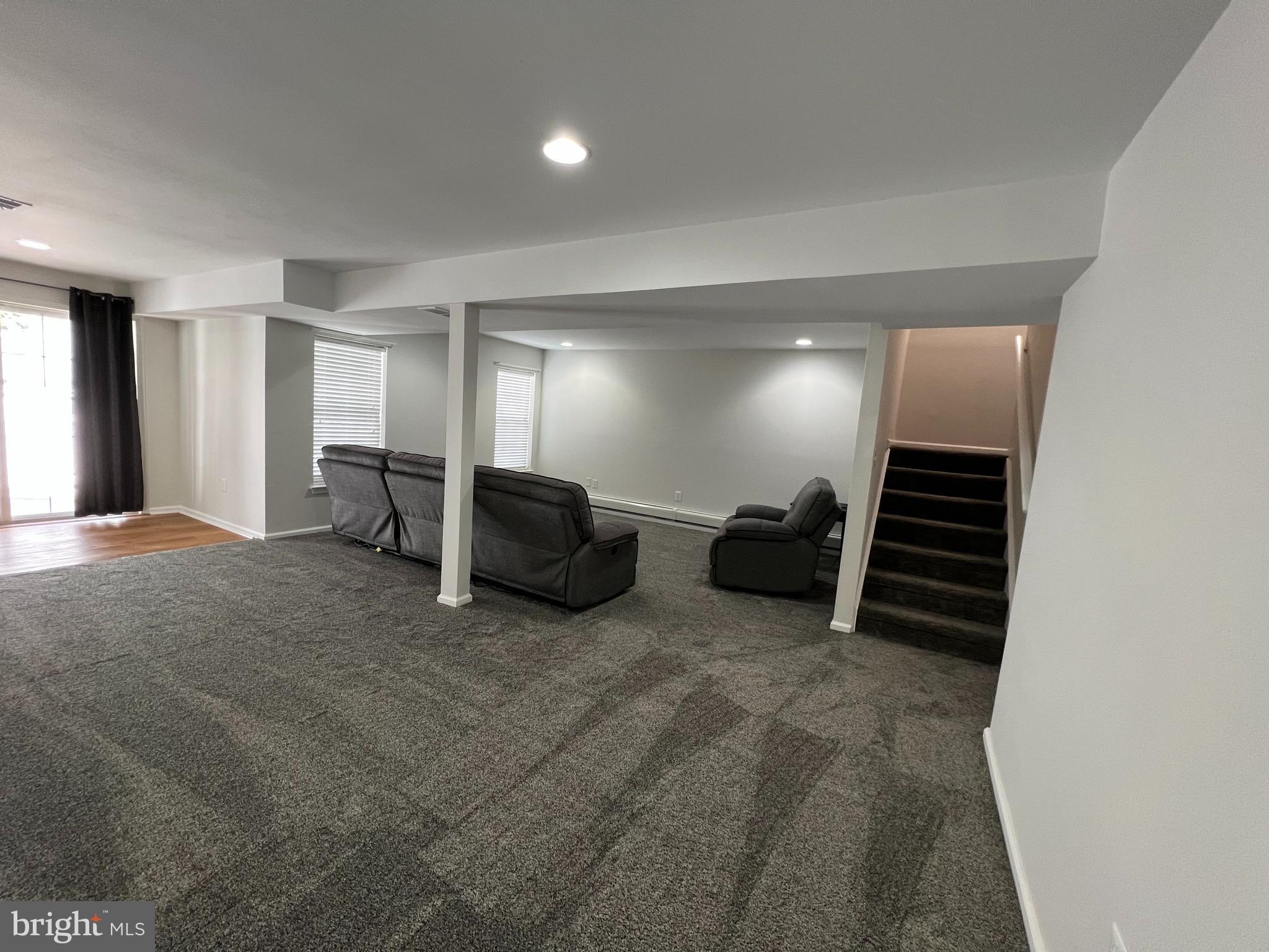 10 Howe Court Pennington, NJ 08534 - Photo 12 of 39 a living room with furniture and a walk in closet