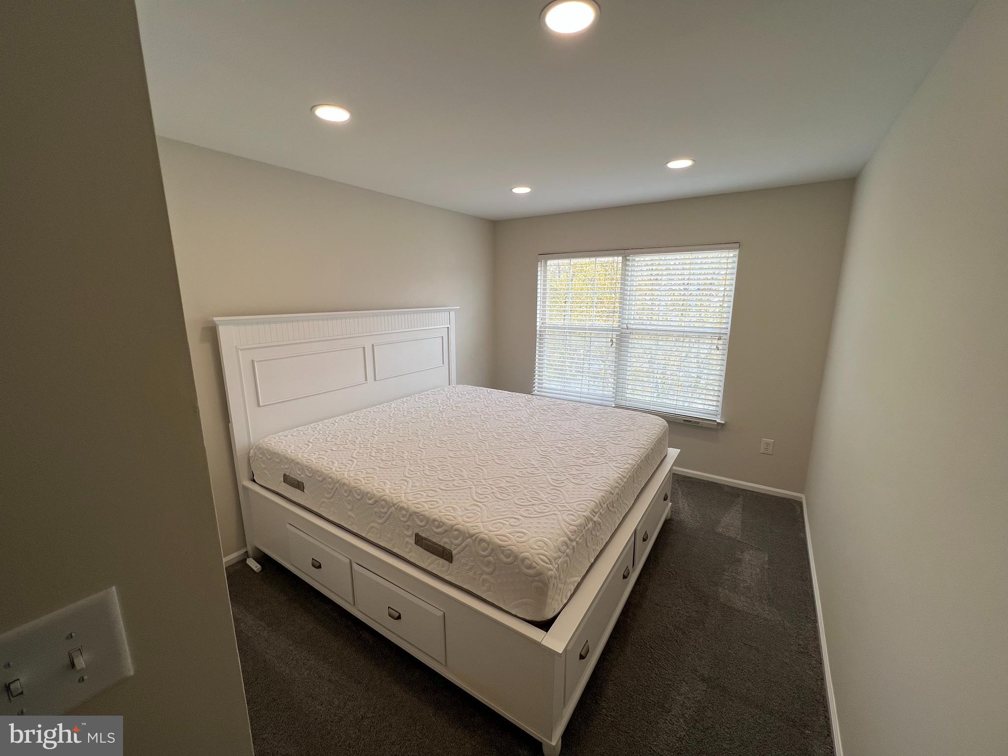 10 Howe Court Pennington, NJ 08534 - Photo 15 of 39 a bed sitting in a room next to a window