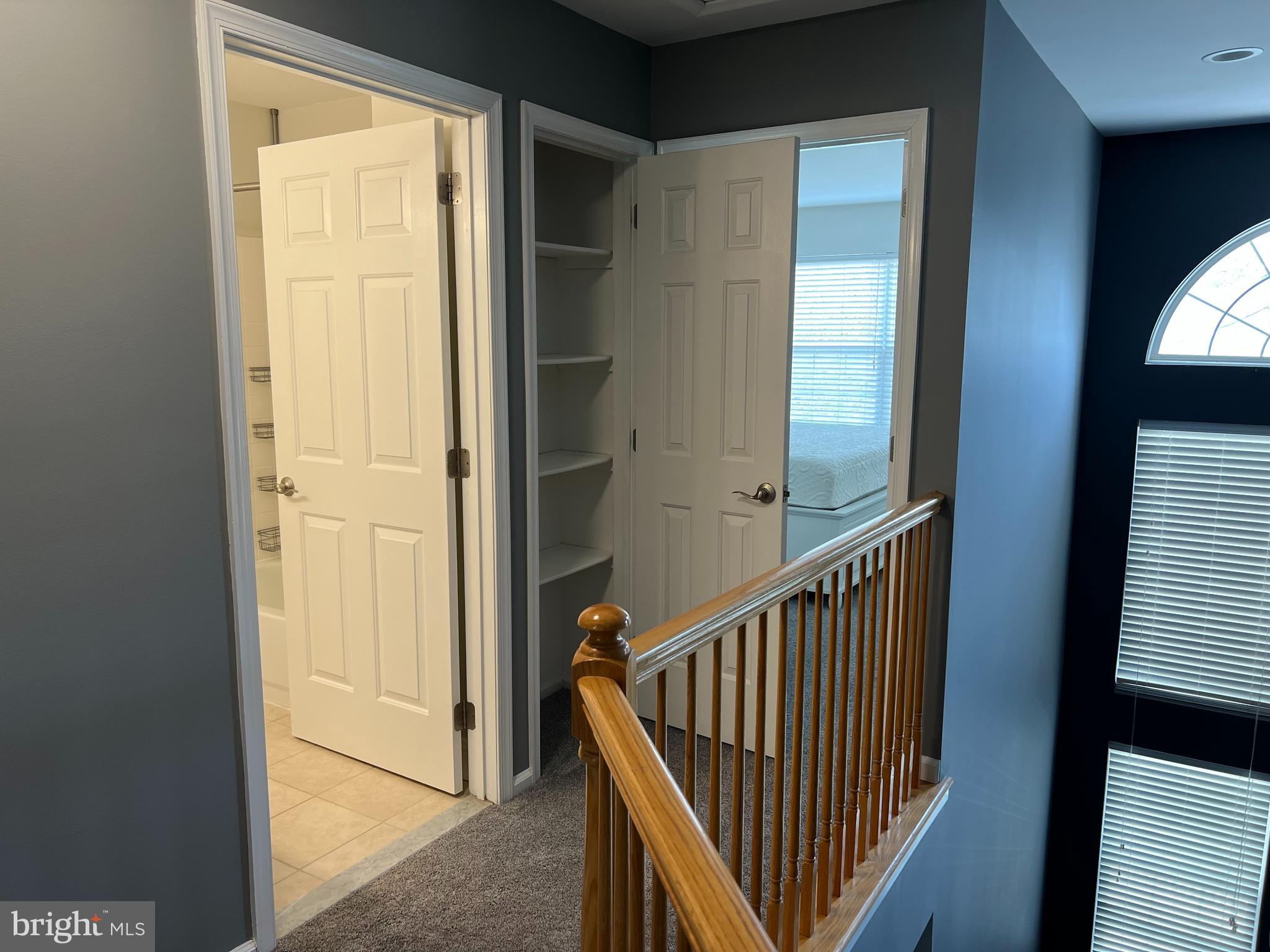 10 Howe Court Pennington, NJ 08534 - Photo 17 of 39 a view of a hallway with wooden floor and staircase