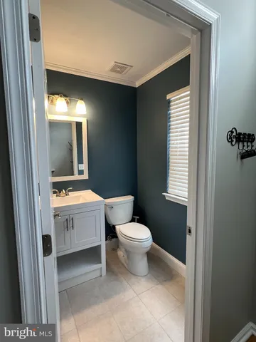 a view of room with stairs and a cabinet