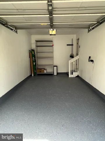 an aerial view of residential houses with outdoor space and parking