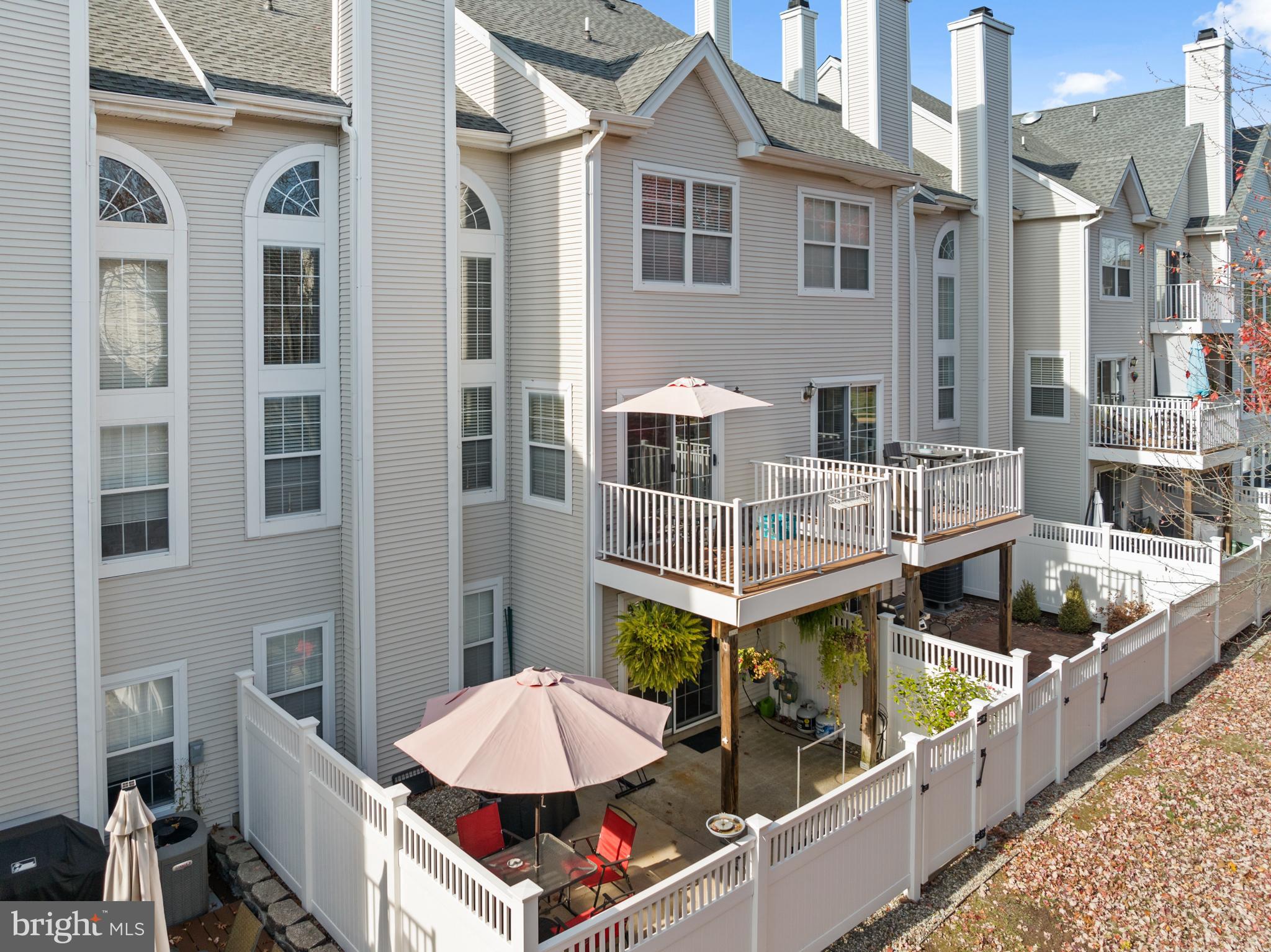 10 Howe Court Pennington, NJ 08534 - Photo 27 of 39 a view of a balcony with two chairs and a barbeque
