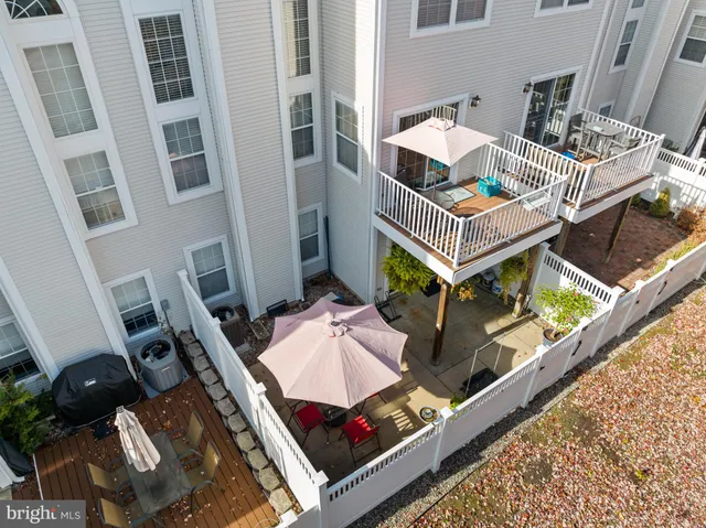 an aerial view of a house with a yard and sitting space
