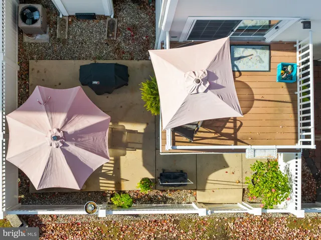 a view of balcony with wooden floor and outdoor seating