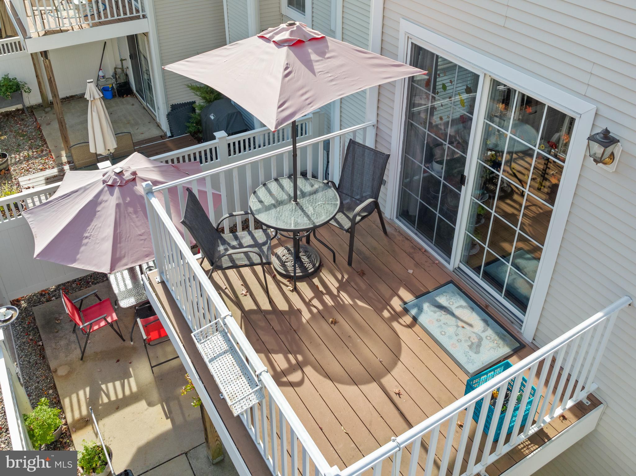 10 Howe Court Pennington, NJ 08534 - Photo 30 of 39 a view of balcony with wooden floor and outdoor seating