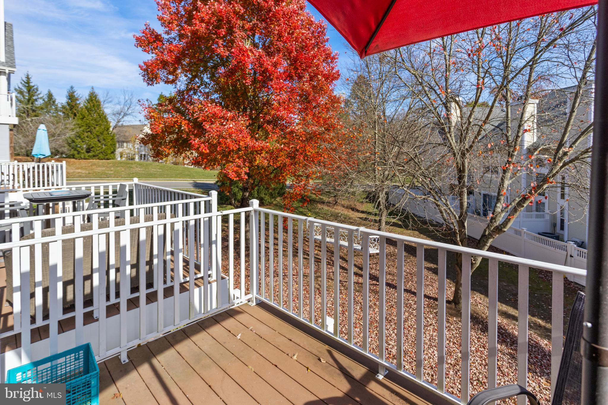 10 Howe Court Pennington, NJ 08534 - Photo 32 of 39 a view of balcony with wooden floor and fence
