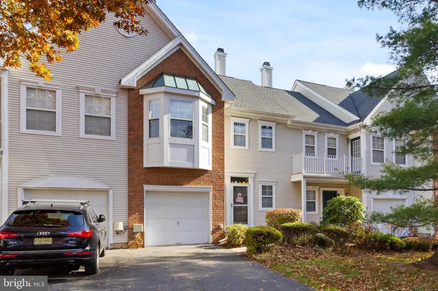 a kitchen with a refrigerator sink and stainless steel appliances