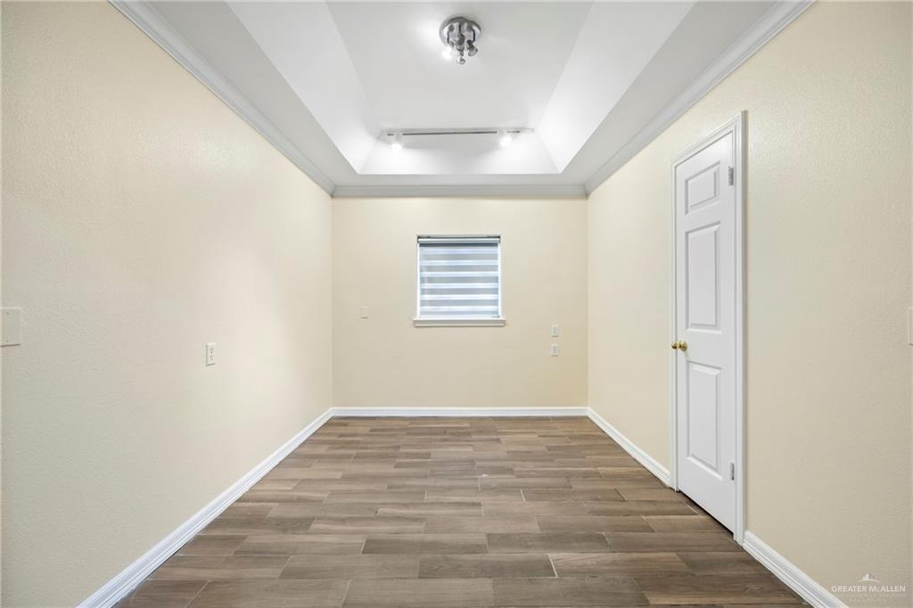 105 East Hawk Avenue McAllen, TX 78504 - Photo 14 of 34 wooden floor in an empty room