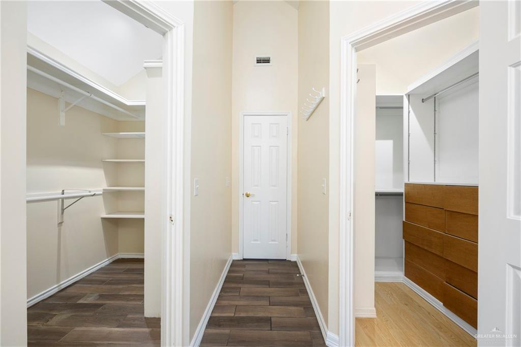 105 East Hawk Avenue McAllen, TX 78504 - Photo 16 of 34 a view of a hallway with wooden floor and closet