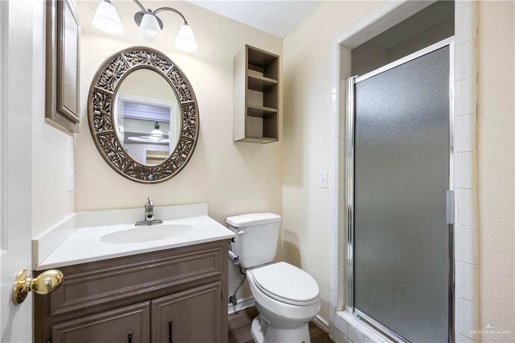 105 East Hawk Avenue McAllen, TX 78504 - Photo 18 of 34 a bathroom with a sink and a toilet