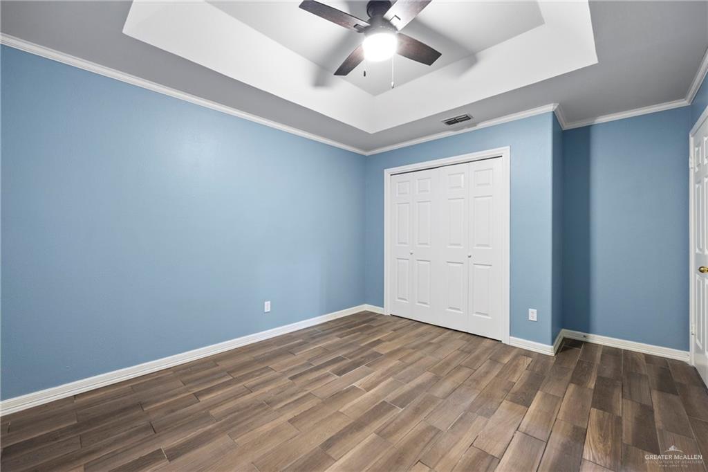 105 East Hawk Avenue McAllen, TX 78504 - Photo 21 of 34 wooden floor in an empty room