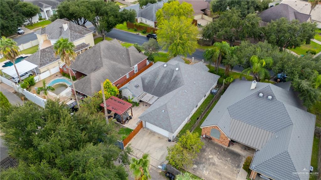 105 East Hawk Avenue McAllen, TX 78504 - Photo 29 of 34 an aerial view of a house with a yard and trees