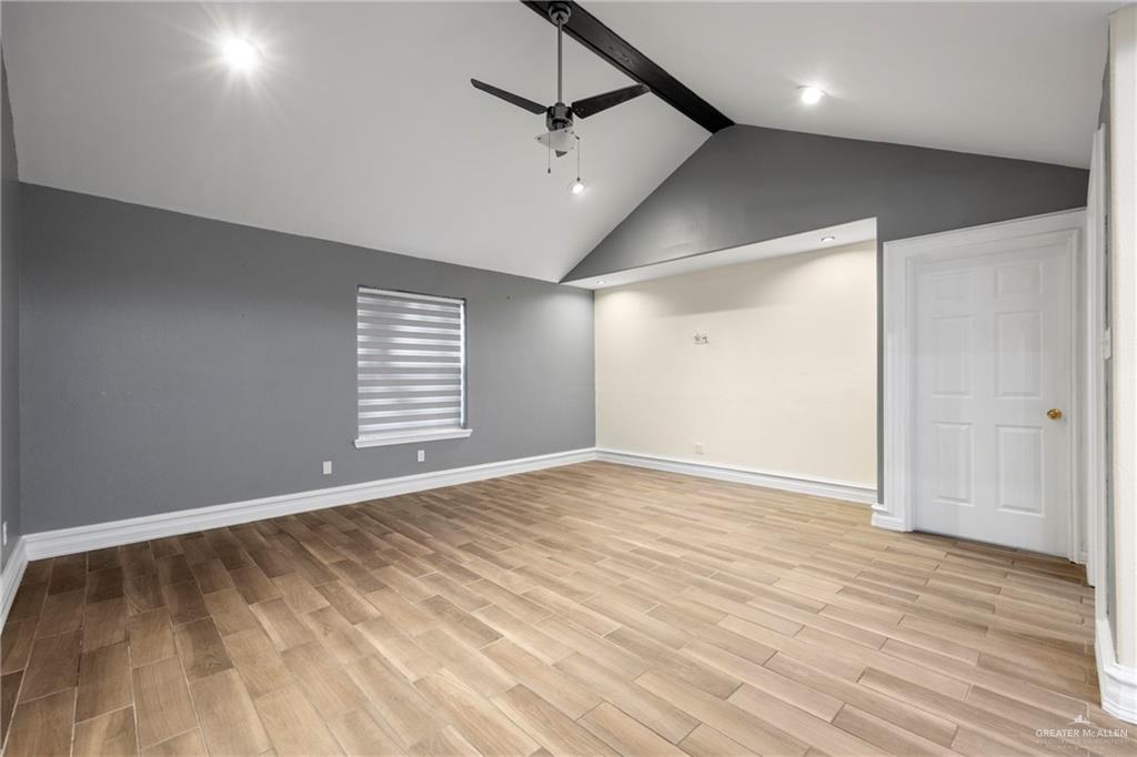 105 East Hawk Avenue McAllen, TX 78504 - Photo 9 of 34 a view of an empty room with a window