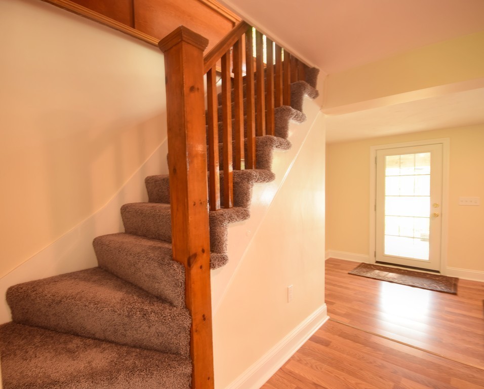 89 Lakeview Avenue Bellingham, MA 02019 - Photo 17 of 30 a view of entryway and hall with wooden floor