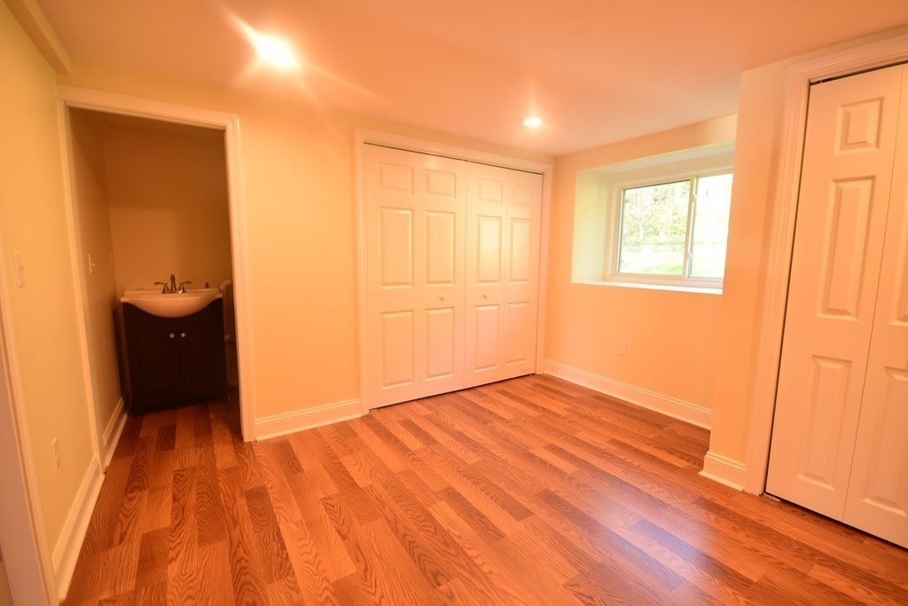 89 Lakeview Avenue Bellingham, MA 02019 - Photo 21 of 30 an empty room with wooden floor and windows