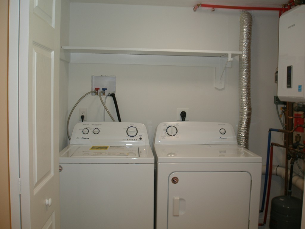 89 Lakeview Avenue Bellingham, MA 02019 - Photo 22 of 30 a utility room with dryer and washer