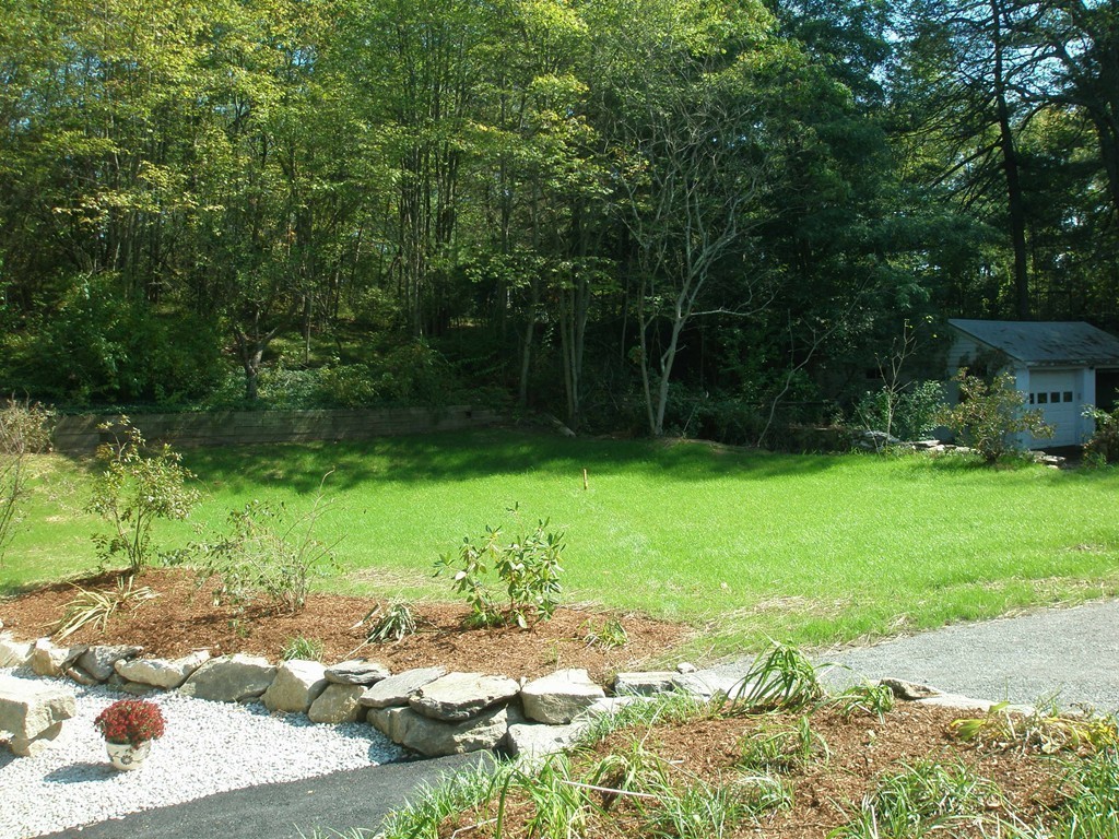 89 Lakeview Avenue Bellingham, MA 02019 - Photo 23 of 30 a view of a backyard with a garden